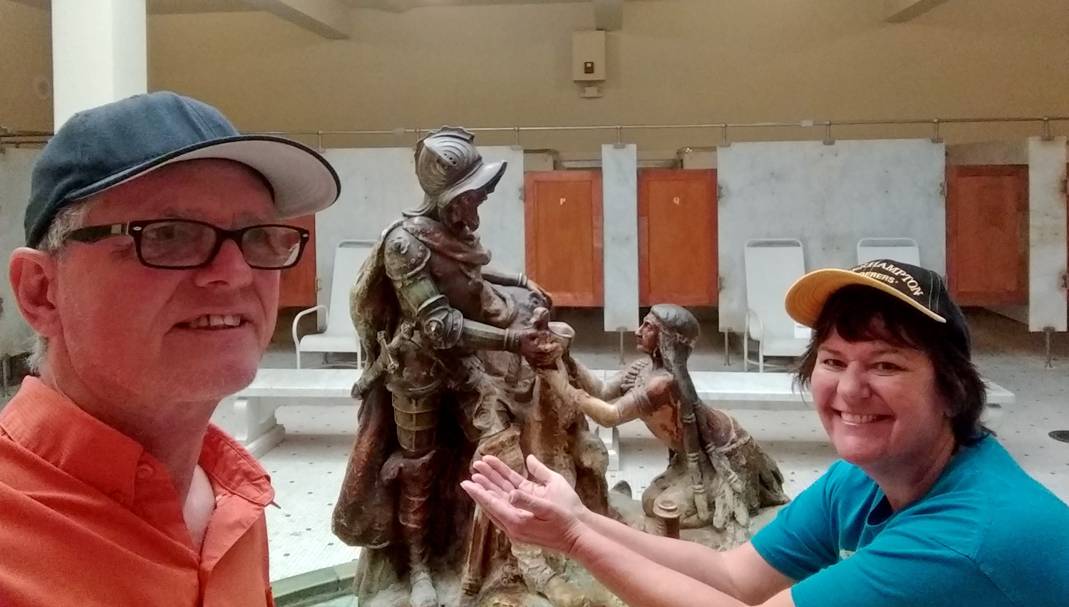 AJ imitiates the woman in the statue, holding supped hands and begging for the fountain of youth liquid.